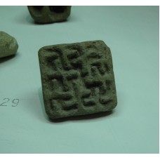 Stone stamp with small swastikas and crosses
